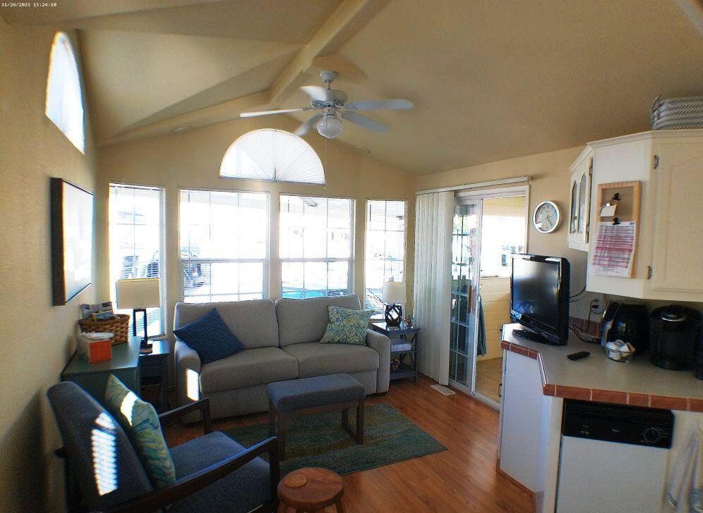 84136 Ave 44, Unit 408 Indio, CA 92203 - Photo 27 of 44 a living room with furniture and a flat screen tv