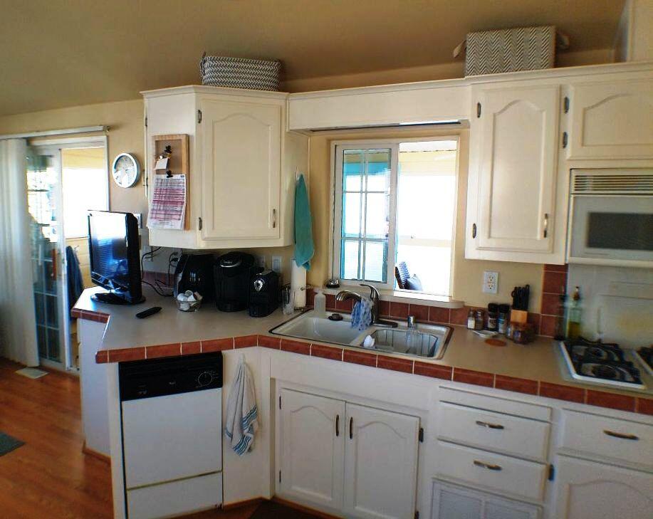 84136 Ave 44, Unit 408 Indio, CA 92203 - Photo 33 of 44 a kitchen with stainless steel appliances granite countertop a sink a stove and cabinets