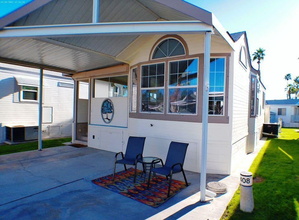 84136 Ave 44, Unit 408 Indio, CA 92203 - Photo 5 of 44 a view of living room kitchen with furniture and rug