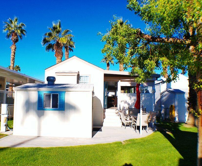 84136 Ave 44, Unit 408 Indio, CA 92203 - Photo 8 of 44 a front view of a house with garden