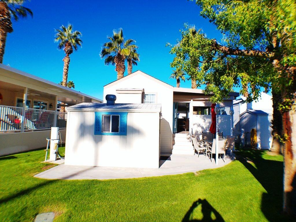 84136 Ave 44, Unit 408 Indio, CA 92203 - Photo 9 of 44 a view of a backyard with a patio