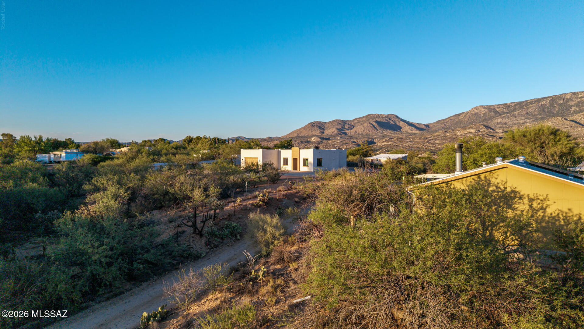 4601 East Magoo Road Tucson, AZ 85739 - Photo 26 of 38 a view of a house with a mountain in the background