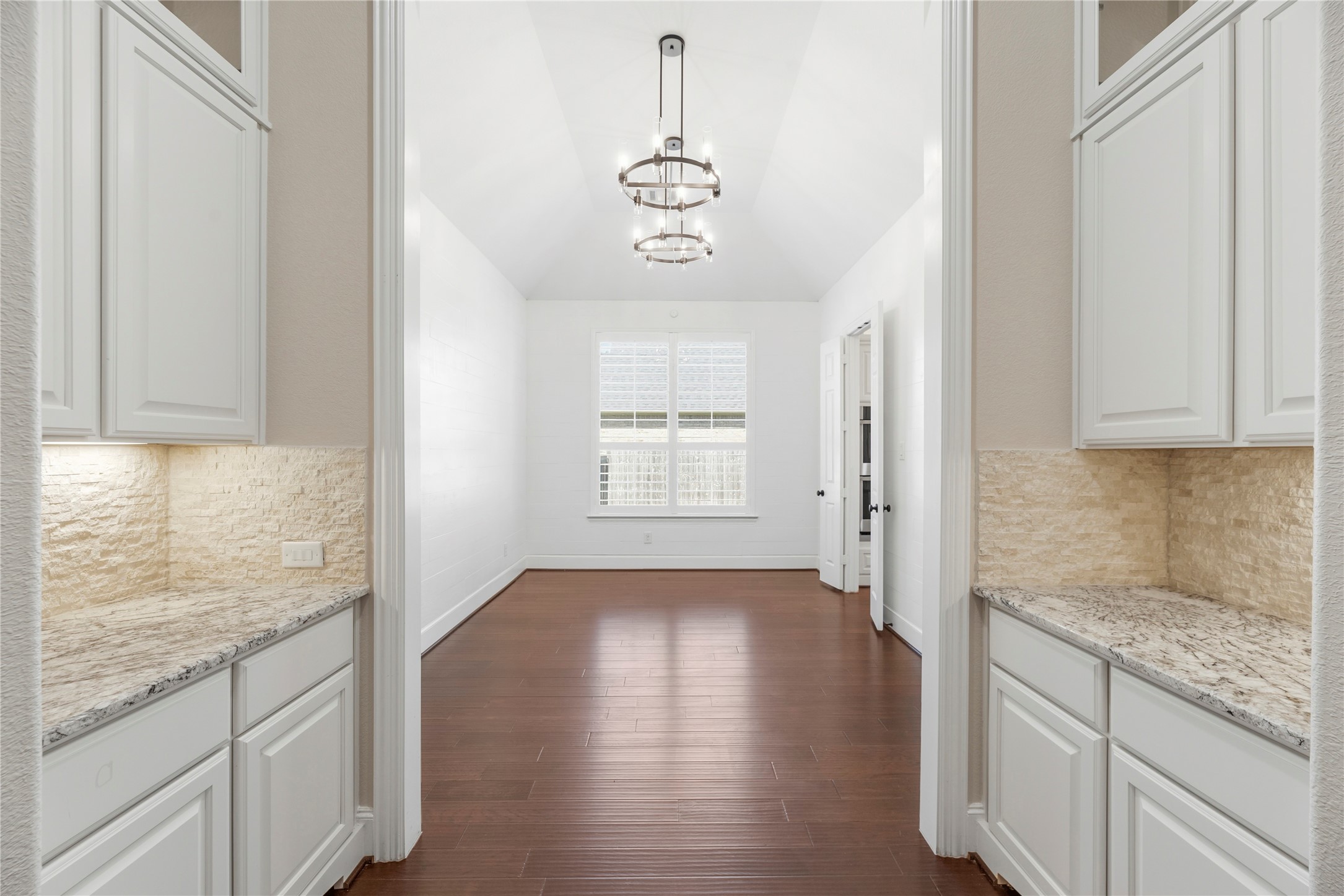 28226 South Firethorne Road Katy, TX 77494 - Photo 7 of 39 This elegant butler's pantry features premium granite countertops and custom soft-closing cabinetry for additional storage and prep.