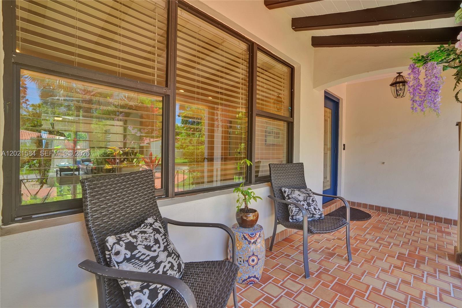 811 Northeast 73rd Street Miami, FL 33138 - Photo 35 of 51 a living room with furniture and floor to ceiling windows