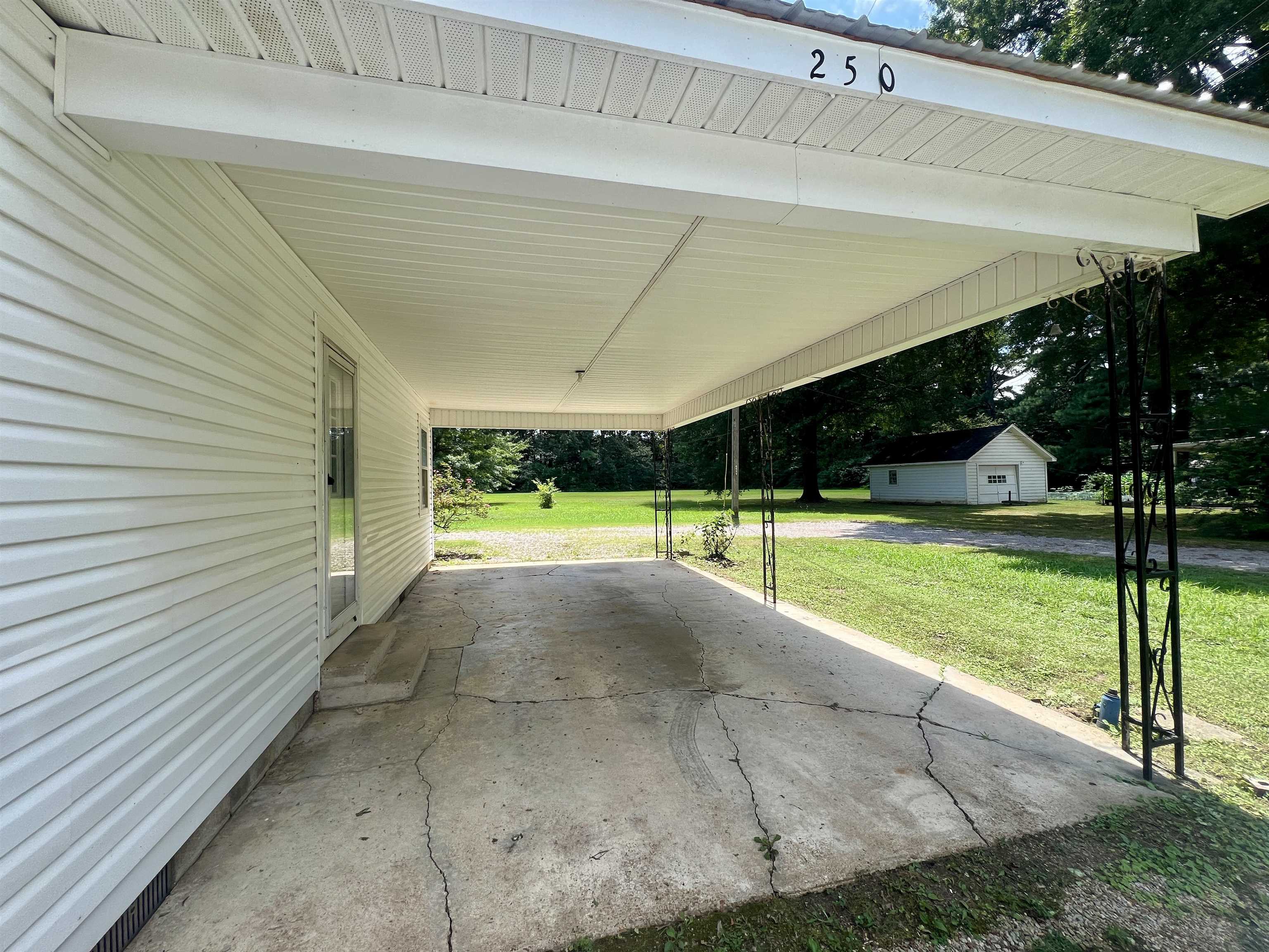 250 Ranch Street Savannah, TN 38372 - Photo 21 of 29 a view of a swimming pool with a yard