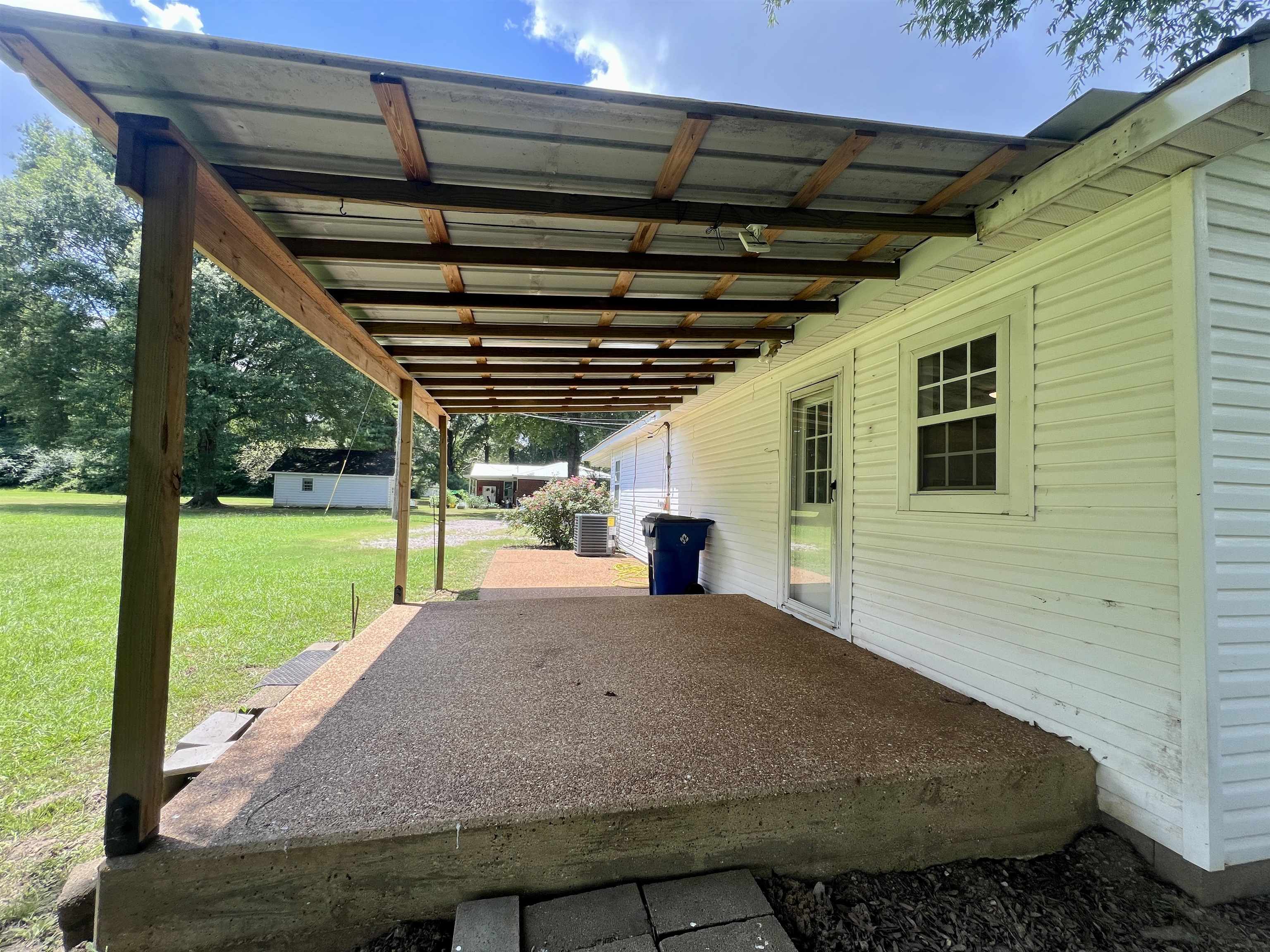 250 Ranch Street Savannah, TN 38372 - Photo 22 of 29 a view of house with backyard and outdoor seating