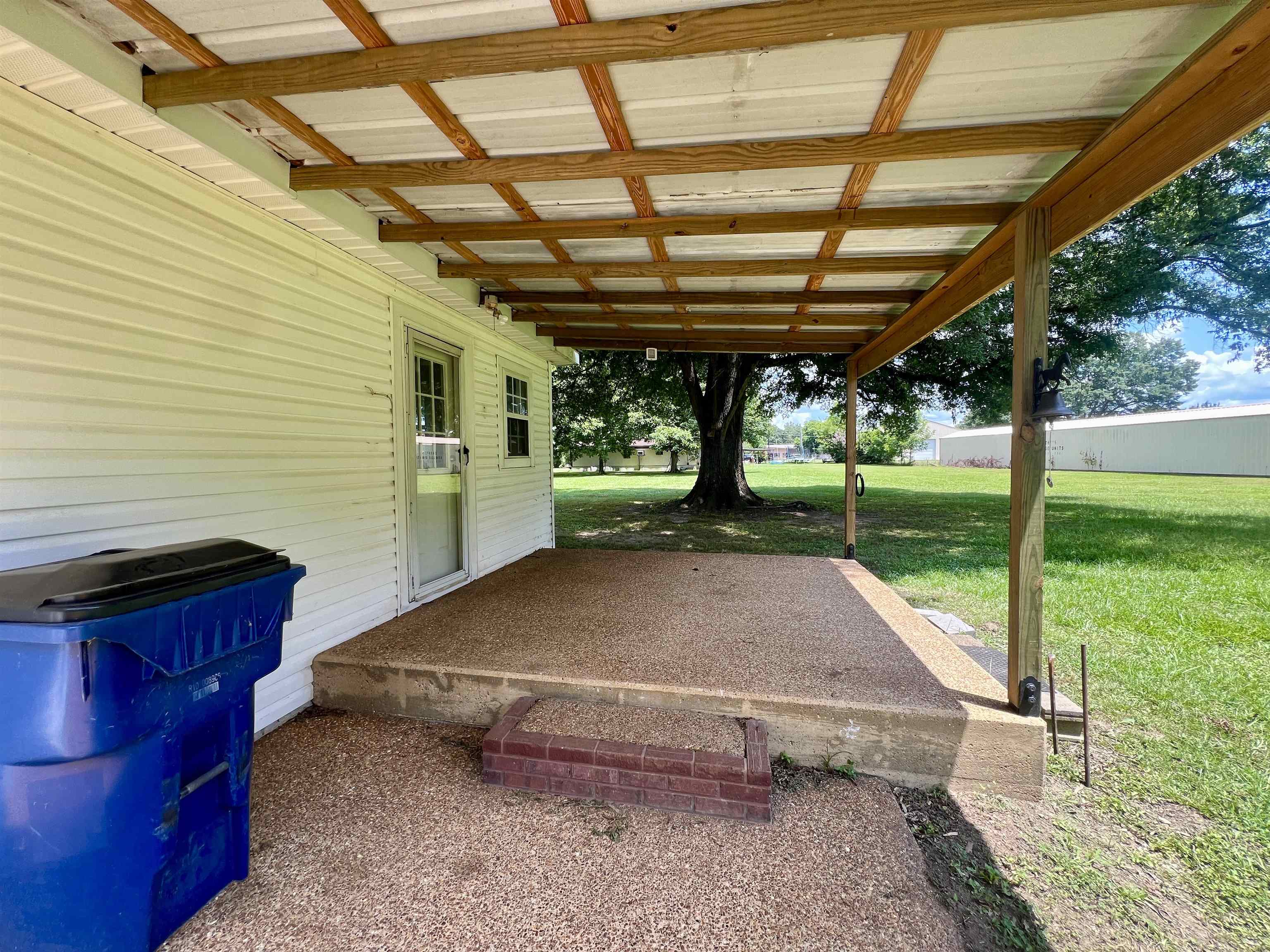250 Ranch Street Savannah, TN 38372 - Photo 23 of 29 a view of a backyard with table and chairs and a barbeque