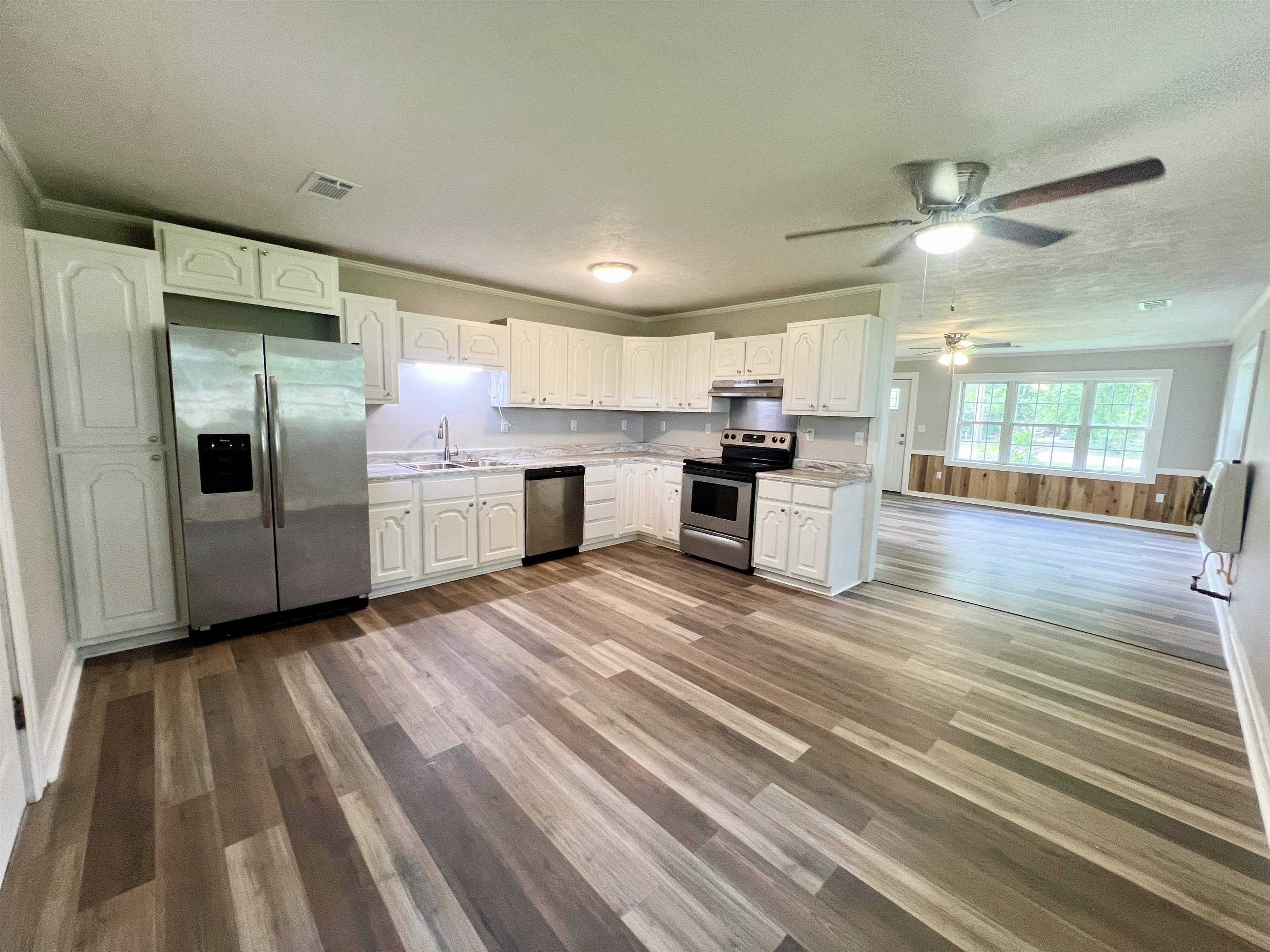 250 Ranch Street Savannah, TN 38372 - Photo 3 of 29 a kitchen with stainless steel appliances granite countertop a refrigerator and a sink
