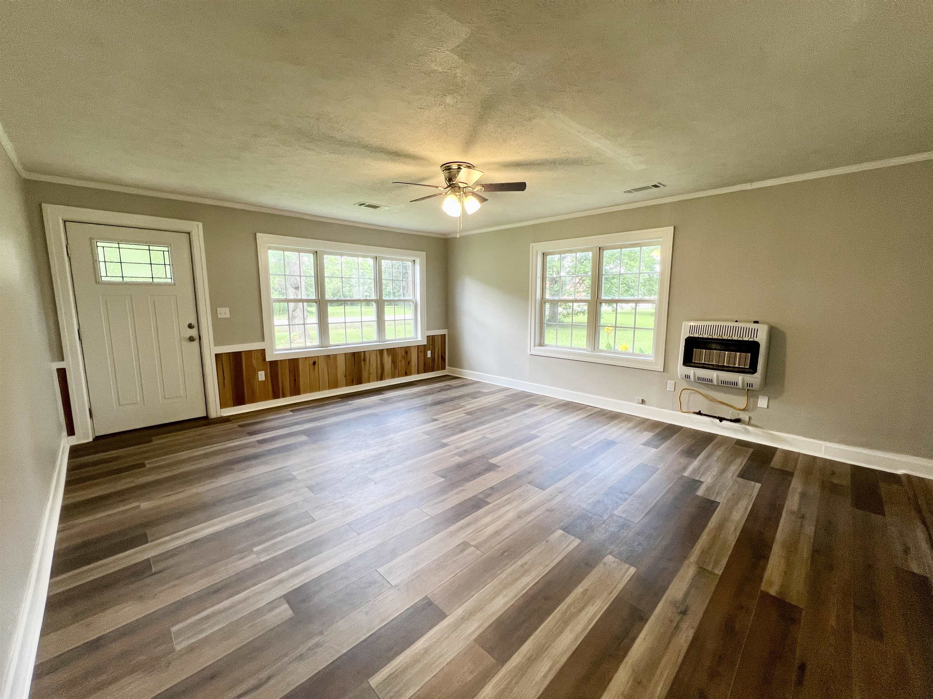 250 Ranch Street Savannah, TN 38372 - Photo 4 of 29 wooden floor in an empty room with a window