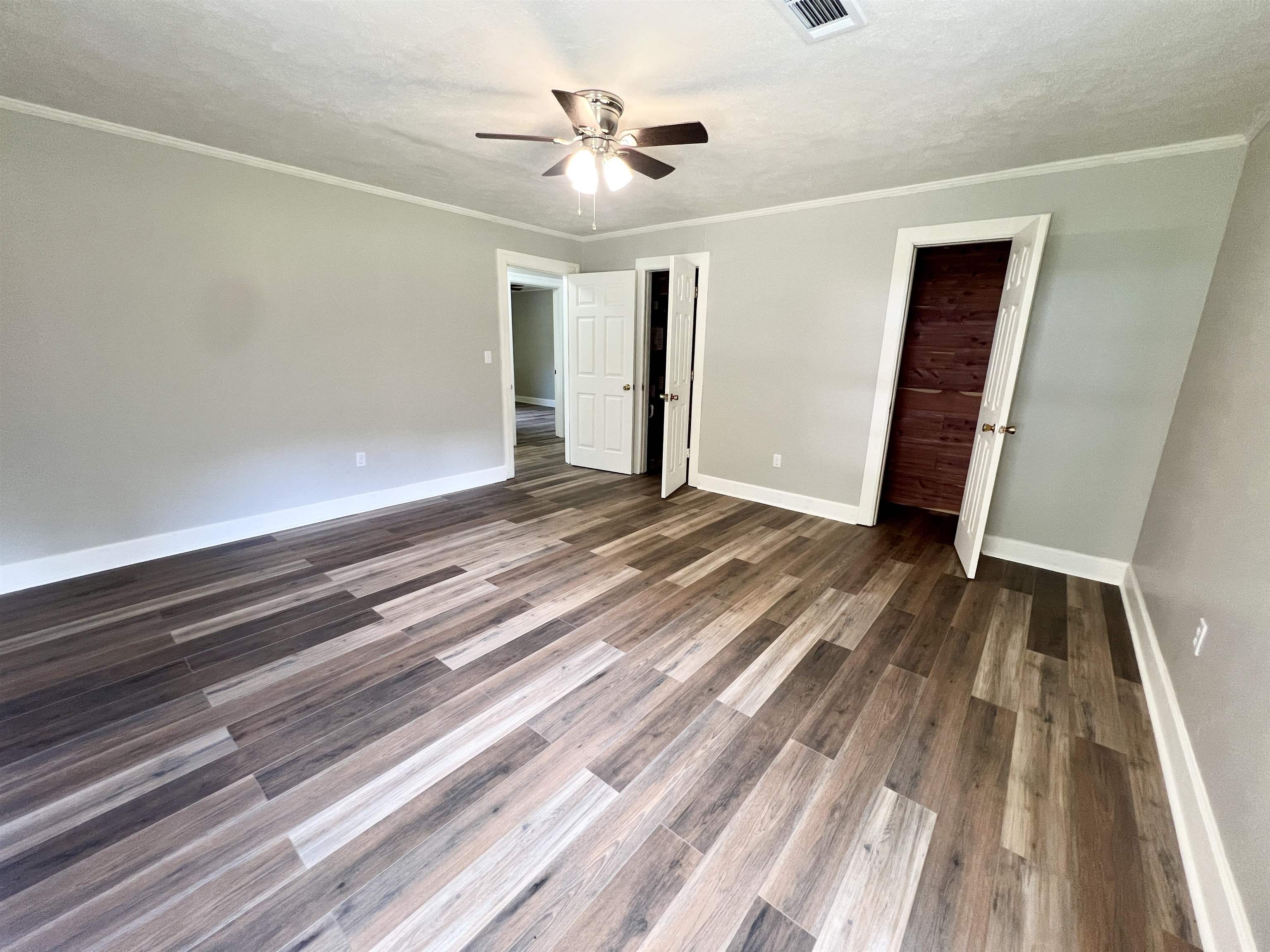 250 Ranch Street Savannah, TN 38372 - Photo 6 of 29 a view of a livingroom with wooden floor and a ceiling fan