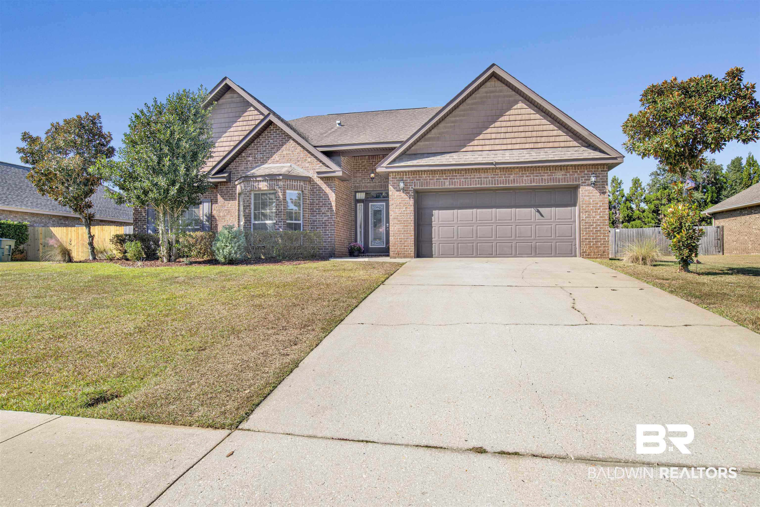 24159 Tullamore Drive Daphne, AL 36526 - Photo 3 of 31 View of front of property with a front yard and a garage
