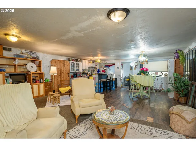 a dining room with furniture and chandelier