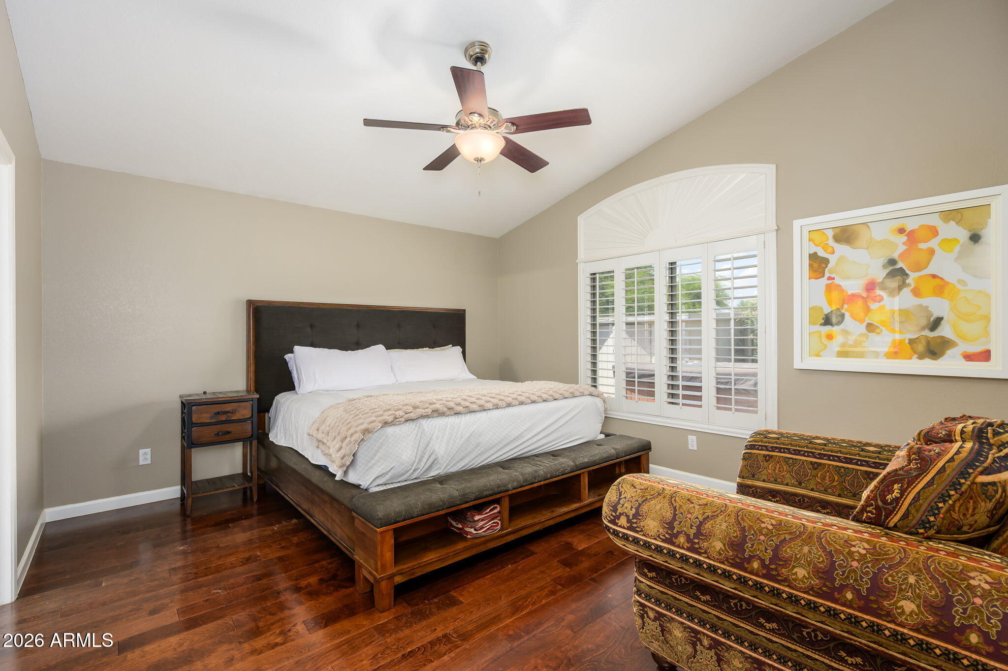 3136 East Roveen Avenue Phoenix, AZ 85032 - Photo 16 of 38 a bed room with a bed and a couch