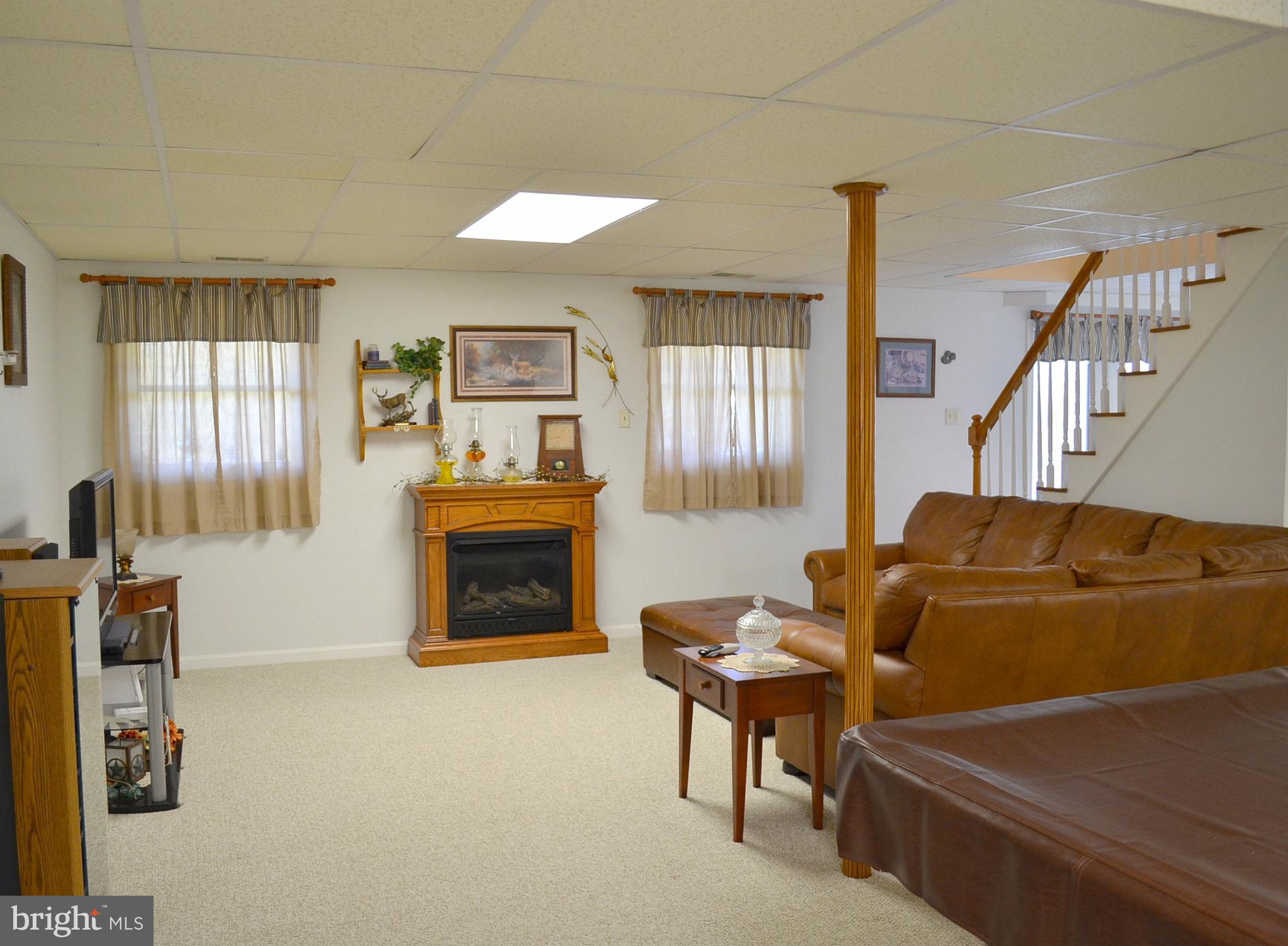827 Fairbee Road Berkeley Springs, WV 25411 - Photo 15 of 30 Lower Level with Gas Fireplace