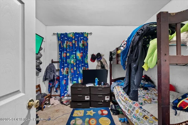 a kitchen with stainless steel appliances a stove a sink and a refrigerator