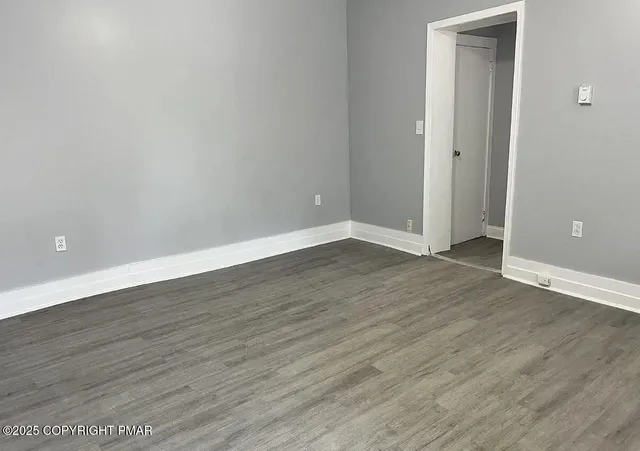 a kitchen with granite countertop a sink and a stove top oven