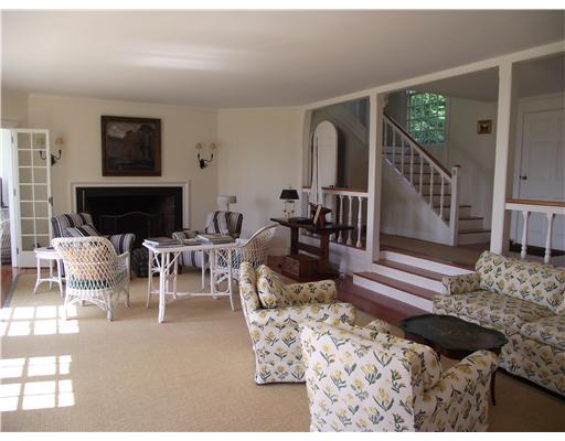 Jamestown Village Jamestown, RI 02835 - Photo 10 of 17 Living Room. The double living room has an over sized fireplace with multiple French doors opening onto the patio.