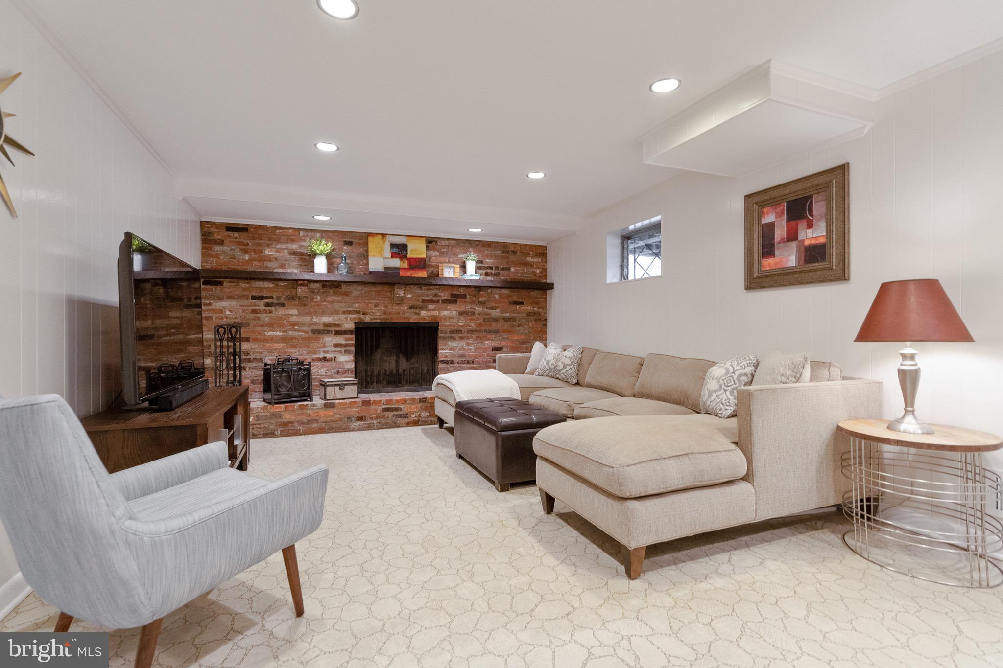 10514 Cascade Place Silver Spring, MD 20902 - Photo 30 of 44 Lower level Recreation room with wood burning FP
