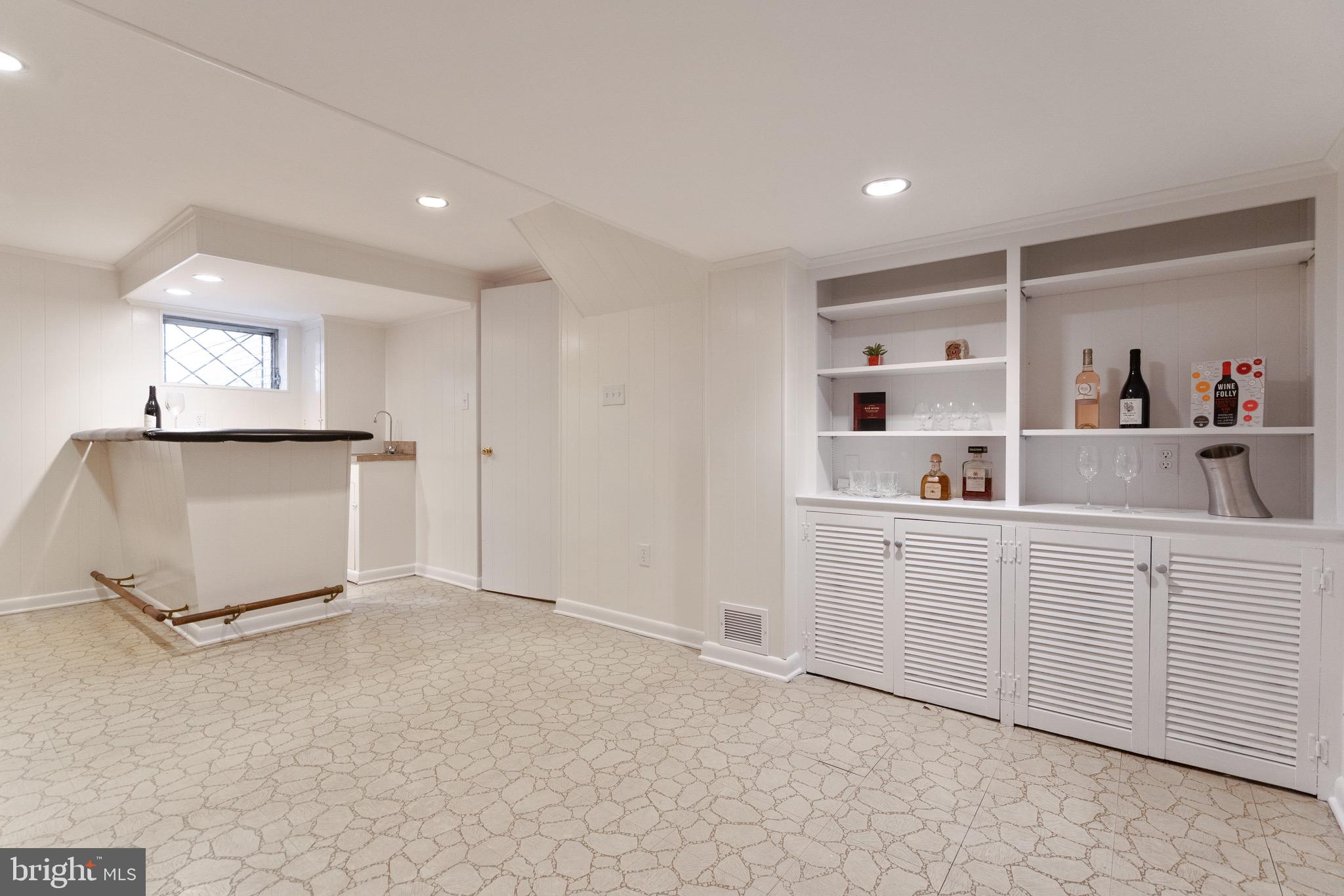 10514 Cascade Place Silver Spring, MD 20902 - Photo 32 of 44 Lower level Recreation room with Built-in shelves
