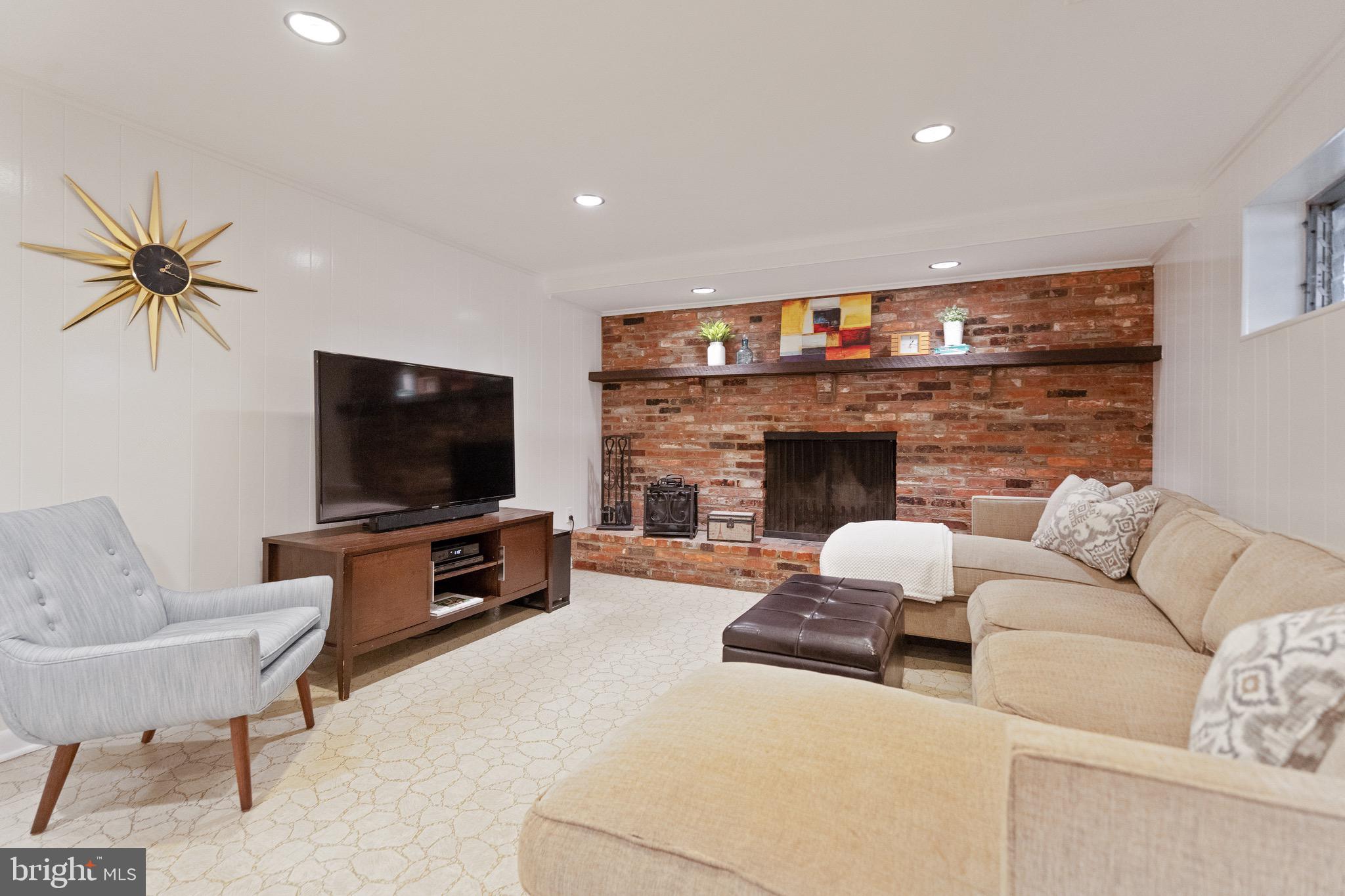 10514 Cascade Place Silver Spring, MD 20902 - Photo 33 of 44 Lower level Recreation room with wood burning FP