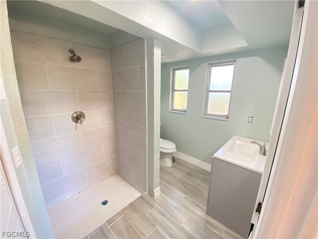 17890 Leetana Road North Fort Myers, FL 33917 - Photo 14 of 25 a bathroom with a shower and a toilet