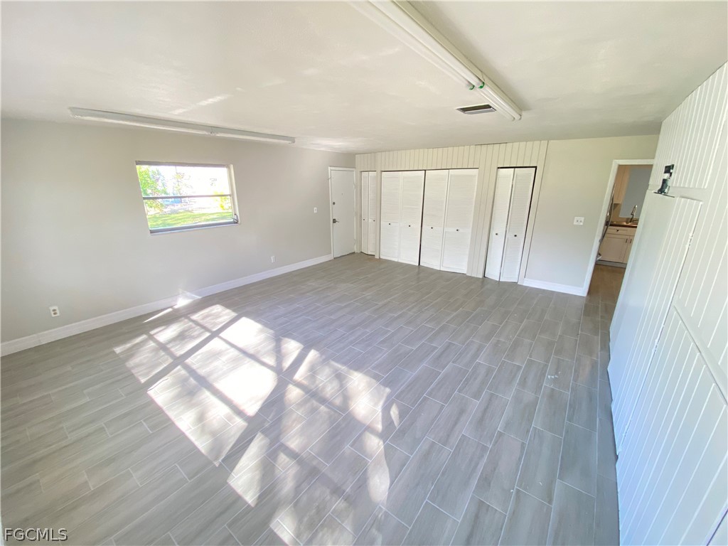 17890 Leetana Road North Fort Myers, FL 33917 - Photo 15 of 25 a view of empty room with wooden floor