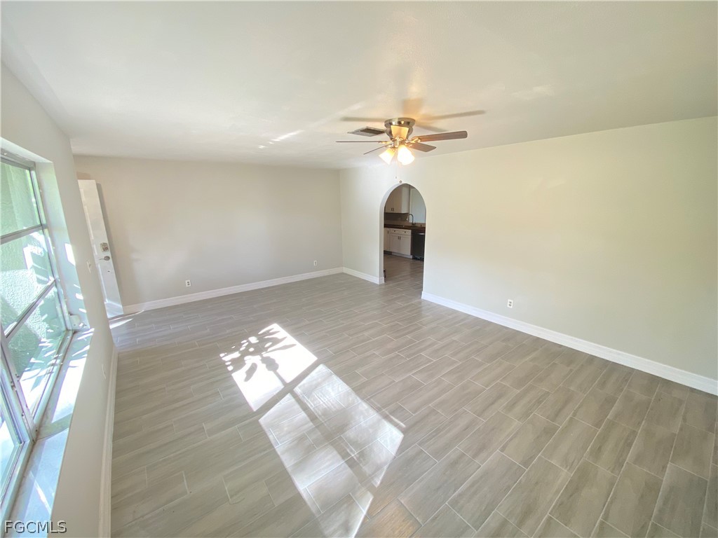 17890 Leetana Road North Fort Myers, FL 33917 - Photo 18 of 25 wooden floor in an empty room with a window