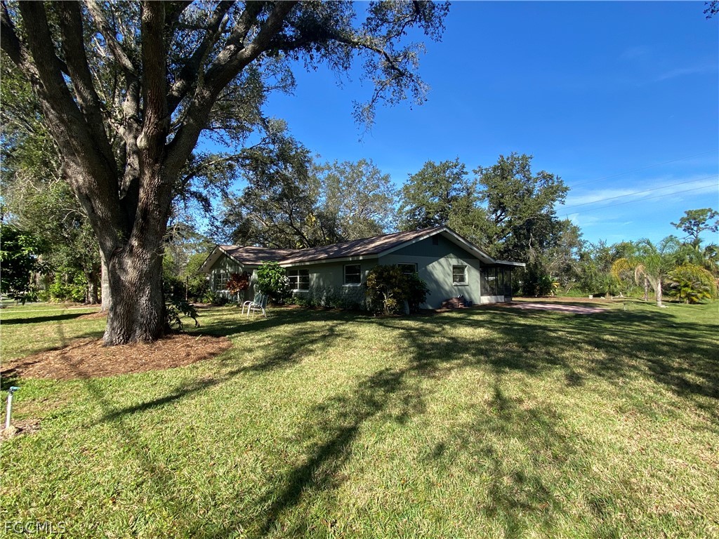 17890 Leetana Road North Fort Myers, FL 33917 - Photo 24 of 25 a view of a yard with a tree