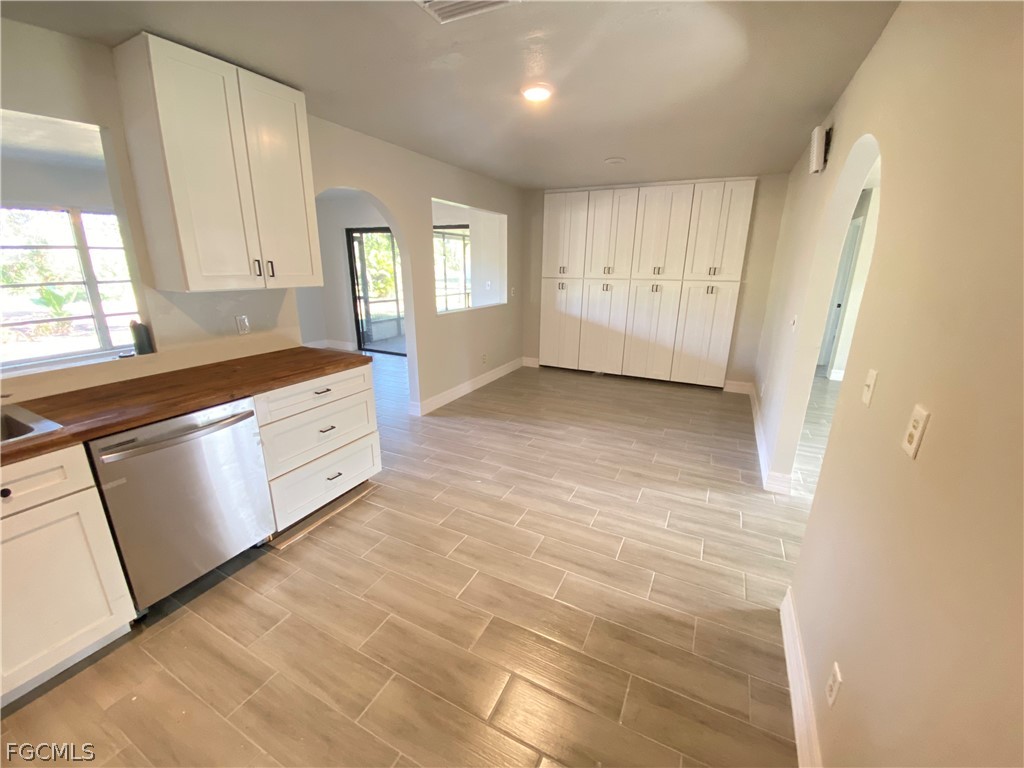 17890 Leetana Road North Fort Myers, FL 33917 - Photo 7 of 25 a view of an empty room with window and cabinet
