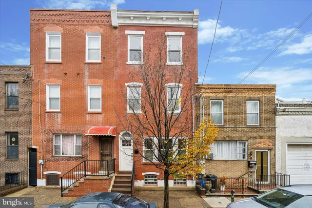 a front view of a building with many windows