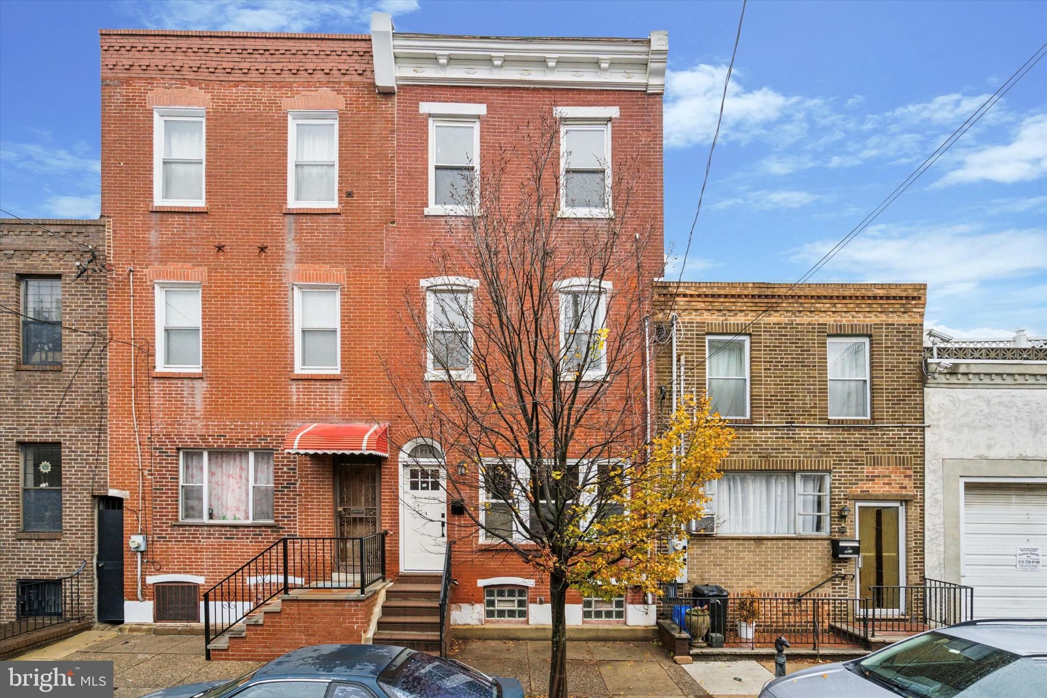 a front view of a building with many windows