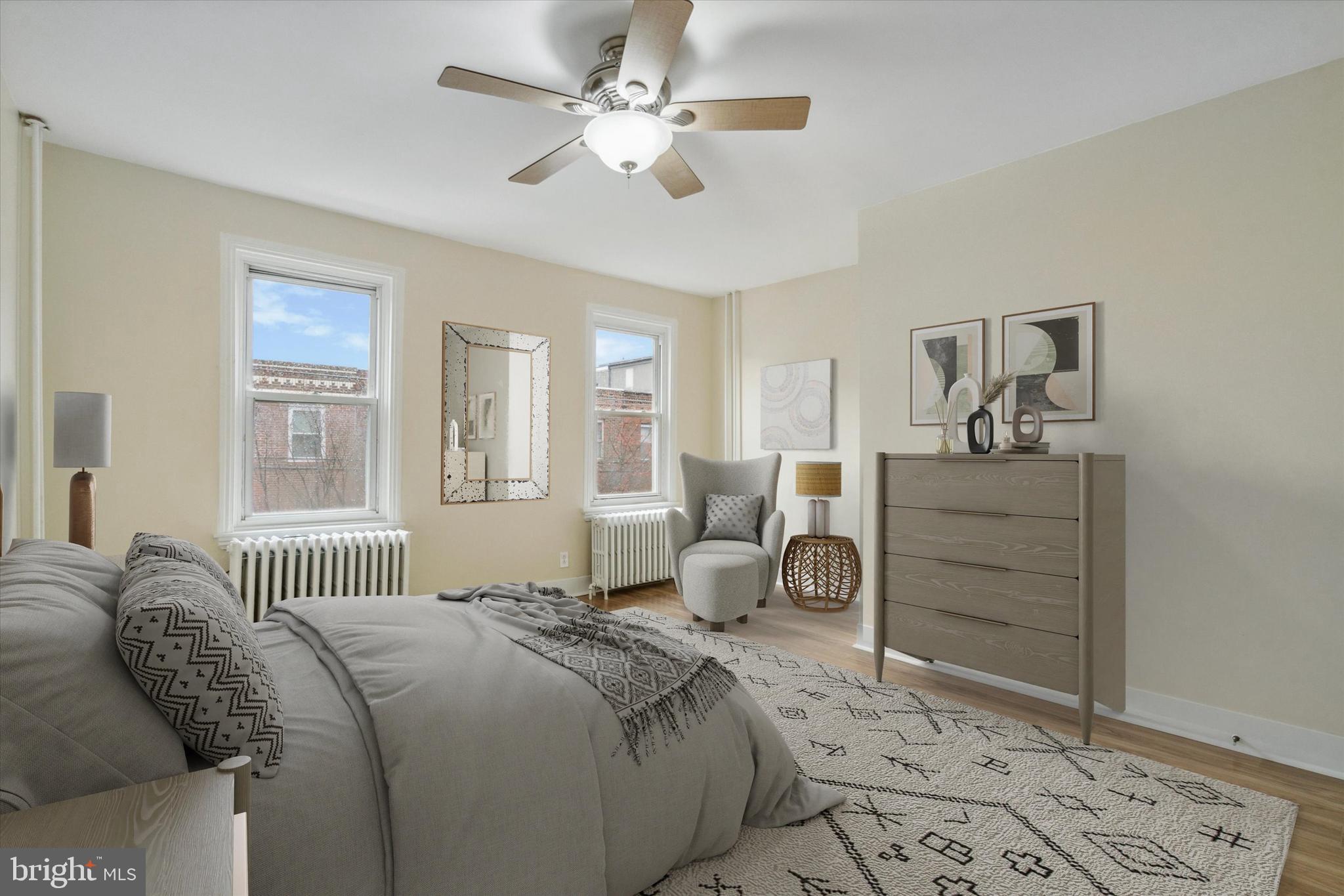711 Reed Street Philadelphia, PA 19147 - Photo 16 of 32 a bedroom with a bed and ceiling fan