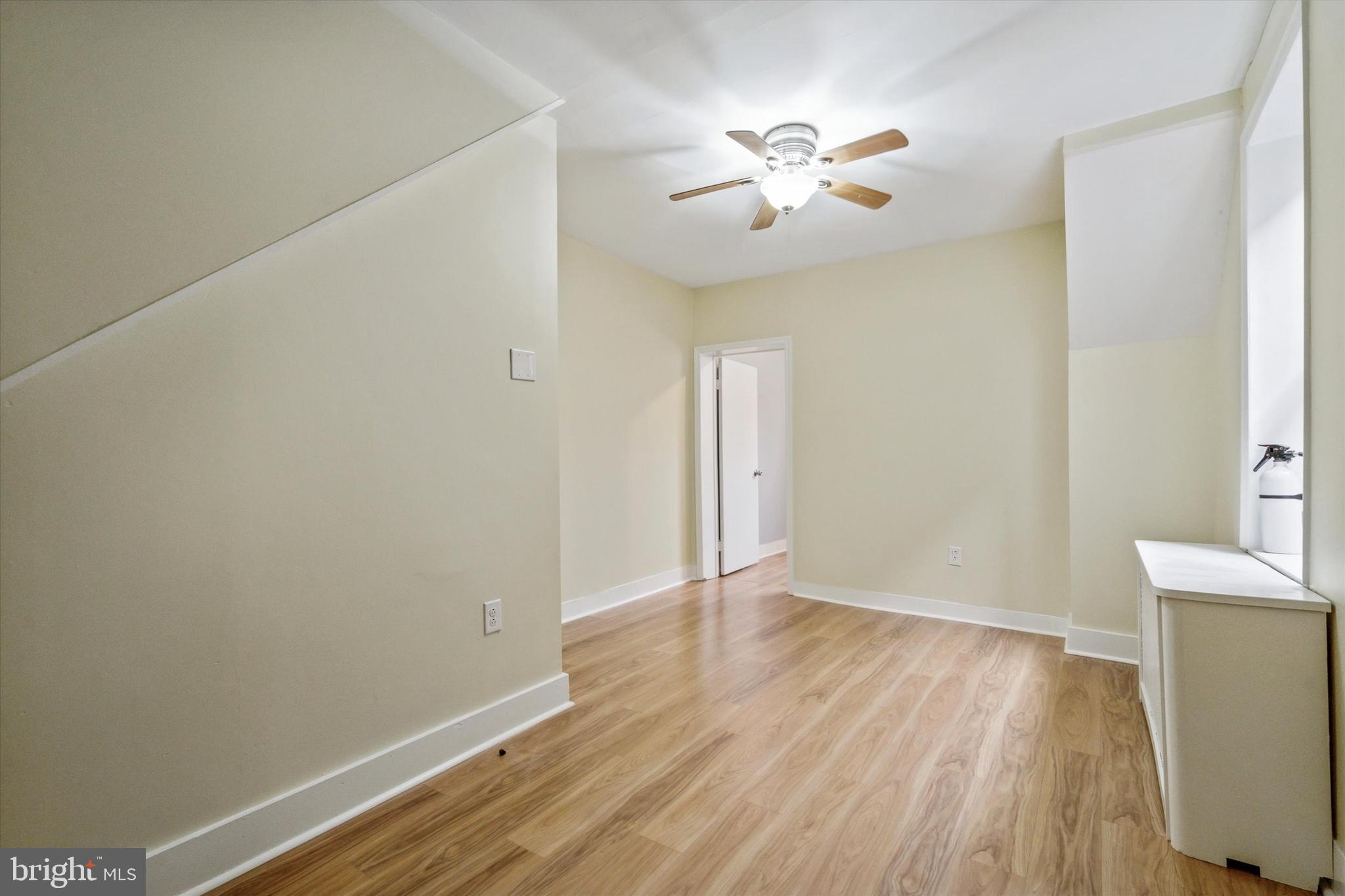 711 Reed Street Philadelphia, PA 19147 - Photo 19 of 32 wooden floor in an empty room with a window