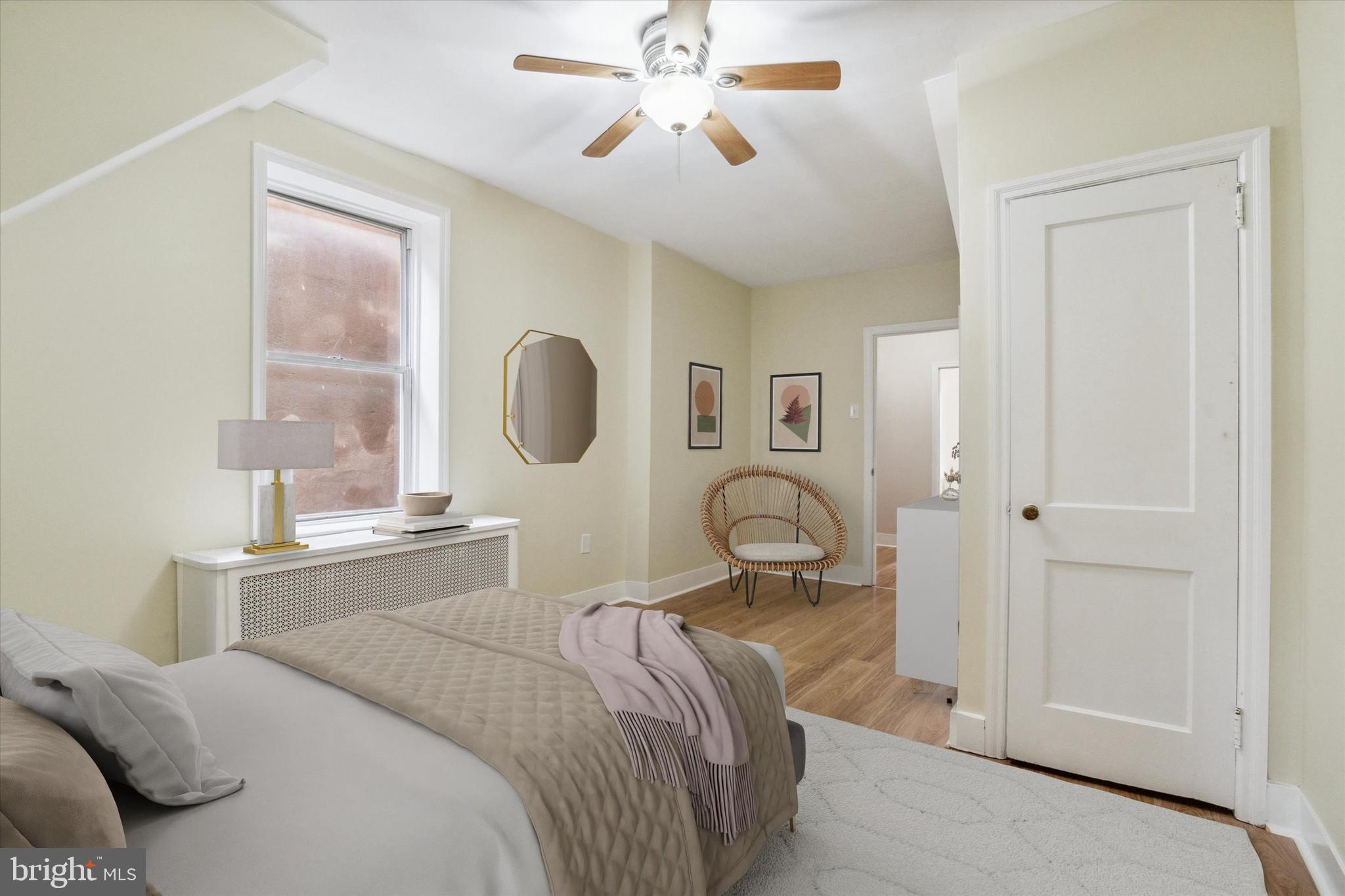 711 Reed Street Philadelphia, PA 19147 - Photo 20 of 32 a bedroom with a bed and a chandelier