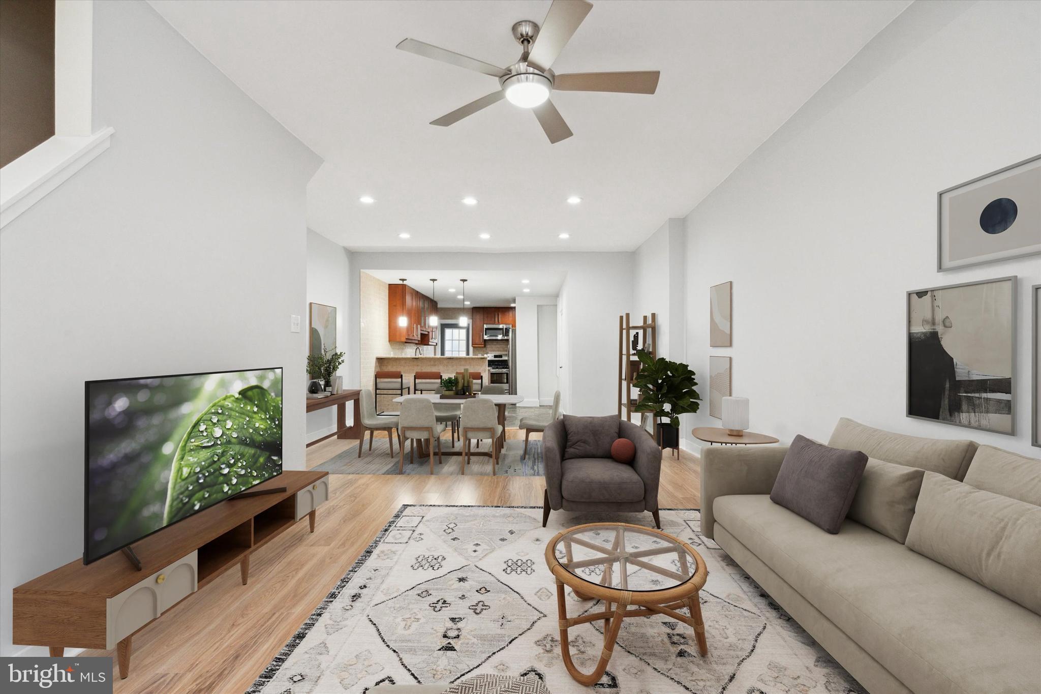 711 Reed Street Philadelphia, PA 19147 - Photo 2 of 32 a living room with furniture a flat screen tv and a window