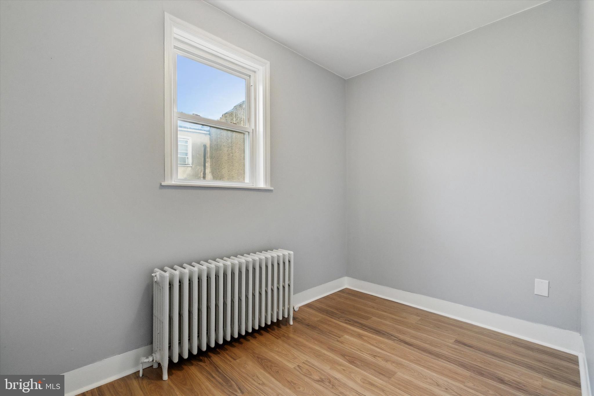 711 Reed Street Philadelphia, PA 19147 - Photo 22 of 32 a view of a room with wooden floor and window
