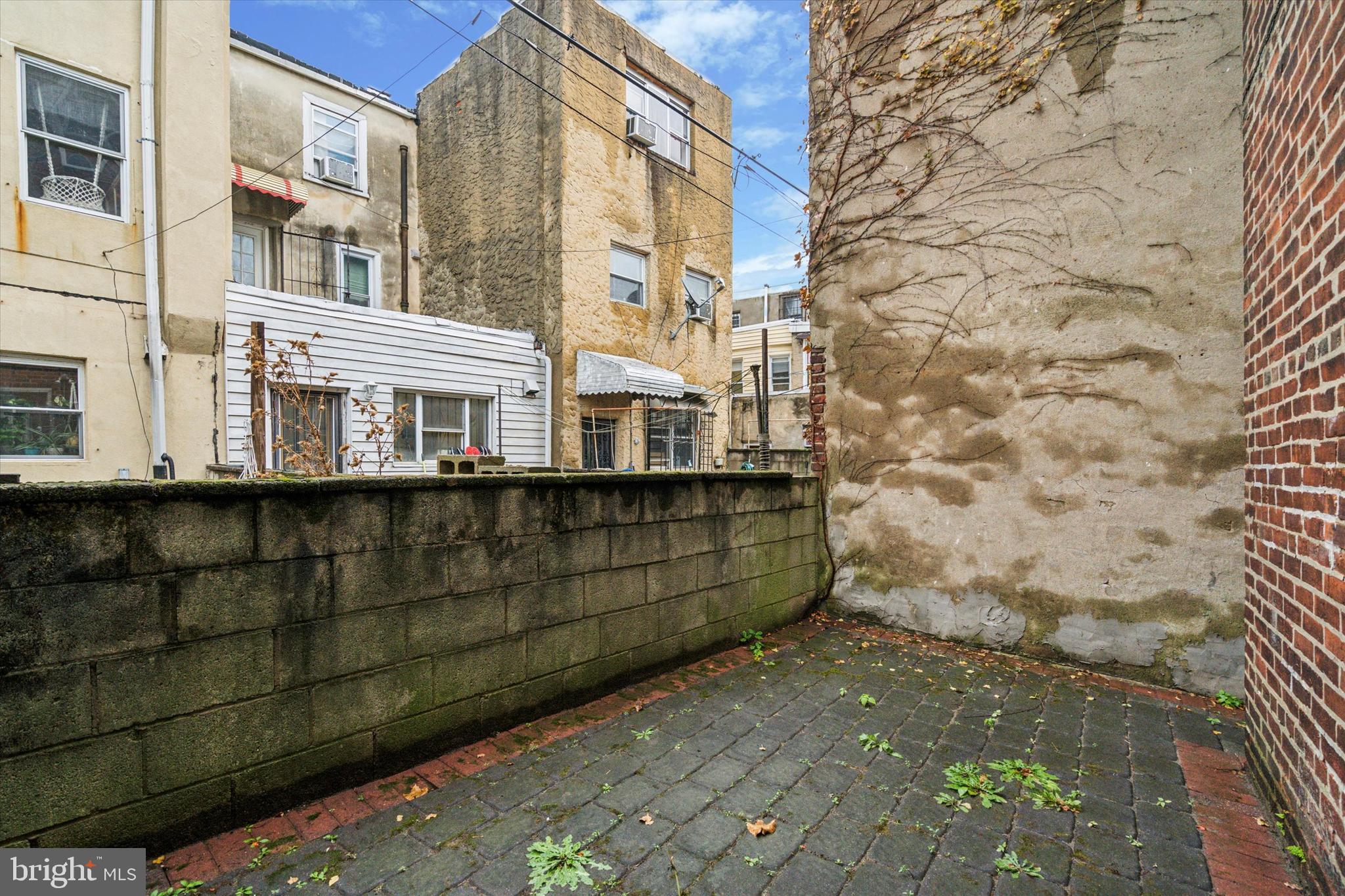 711 Reed Street Philadelphia, PA 19147 - Photo 32 of 32 a view of a brick house with a street
