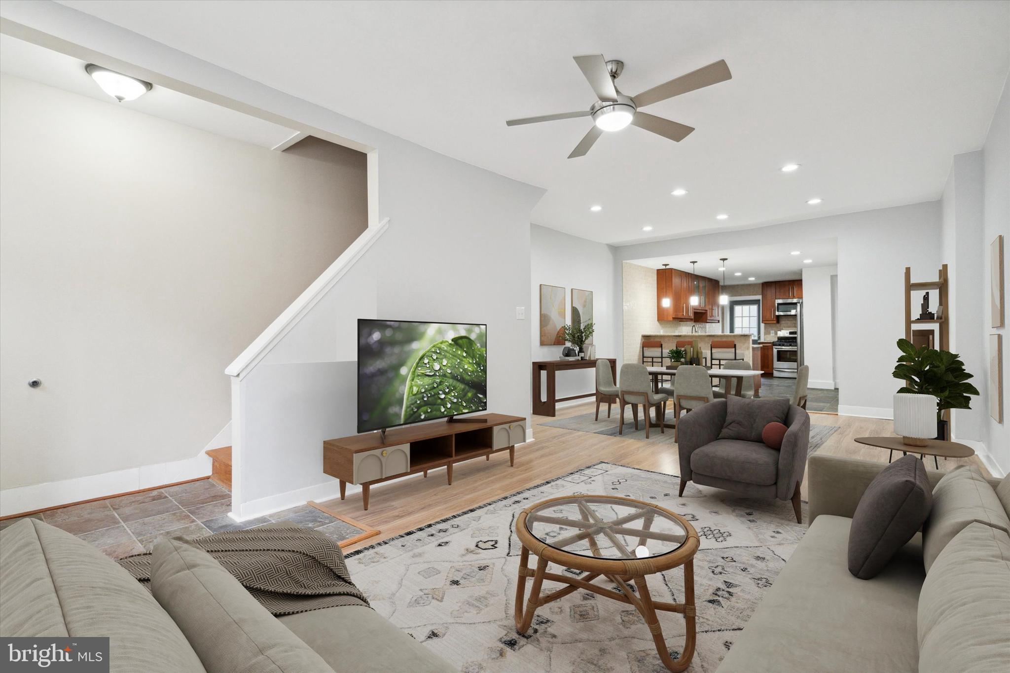 711 Reed Street Philadelphia, PA 19147 - Photo 4 of 32 a living room with furniture kitchen view and a large window