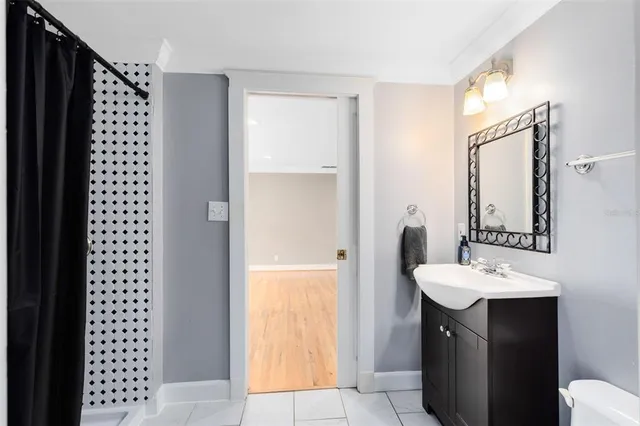 a bathroom with a sink and a mirror