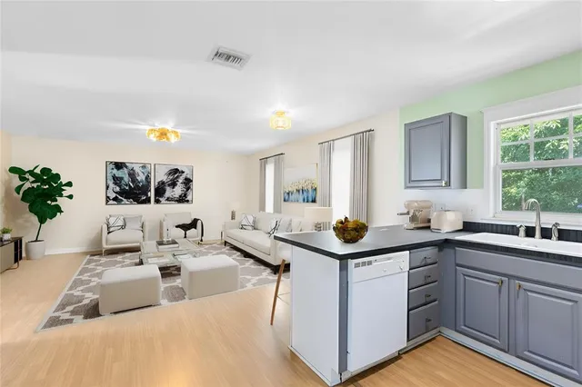 a kitchen with a sink and cabinets
