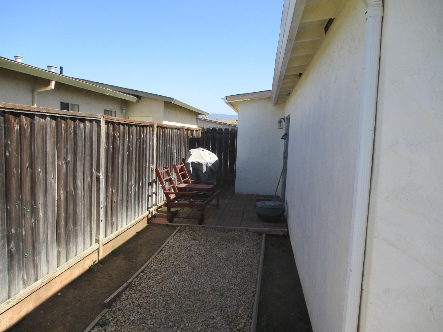 467 Tuttle Avenue Watsonville, CA 95076 - Photo 7 of 7 a view of a porch with wooden floor and stairs