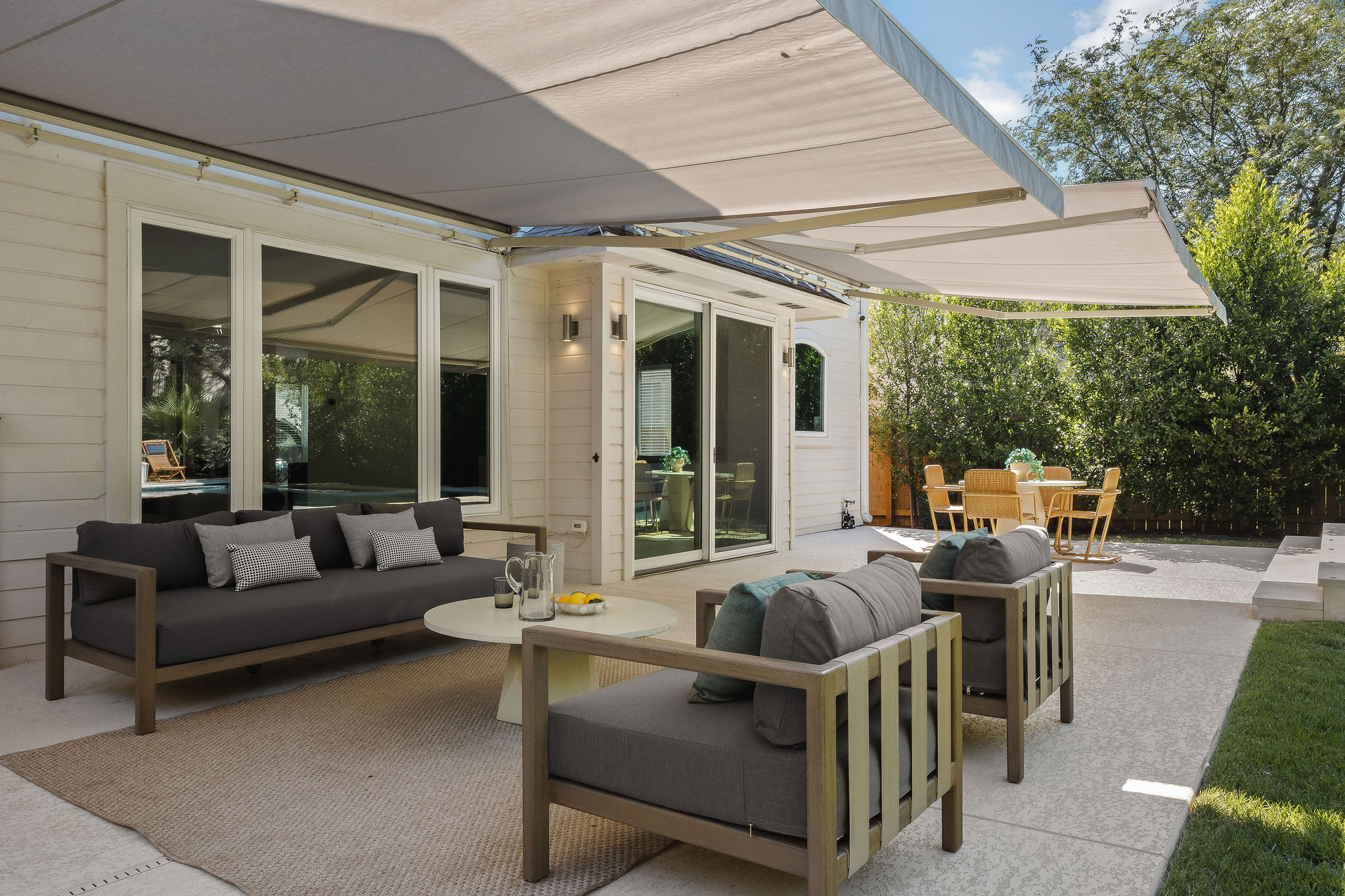 6500 Clay Allison Pass Austin, TX 78749 - Photo 35 of 39 Spacious patio featuring dual retractable awnings for flexible outdoor living