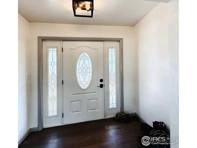 a view of a backyard with plants and patio