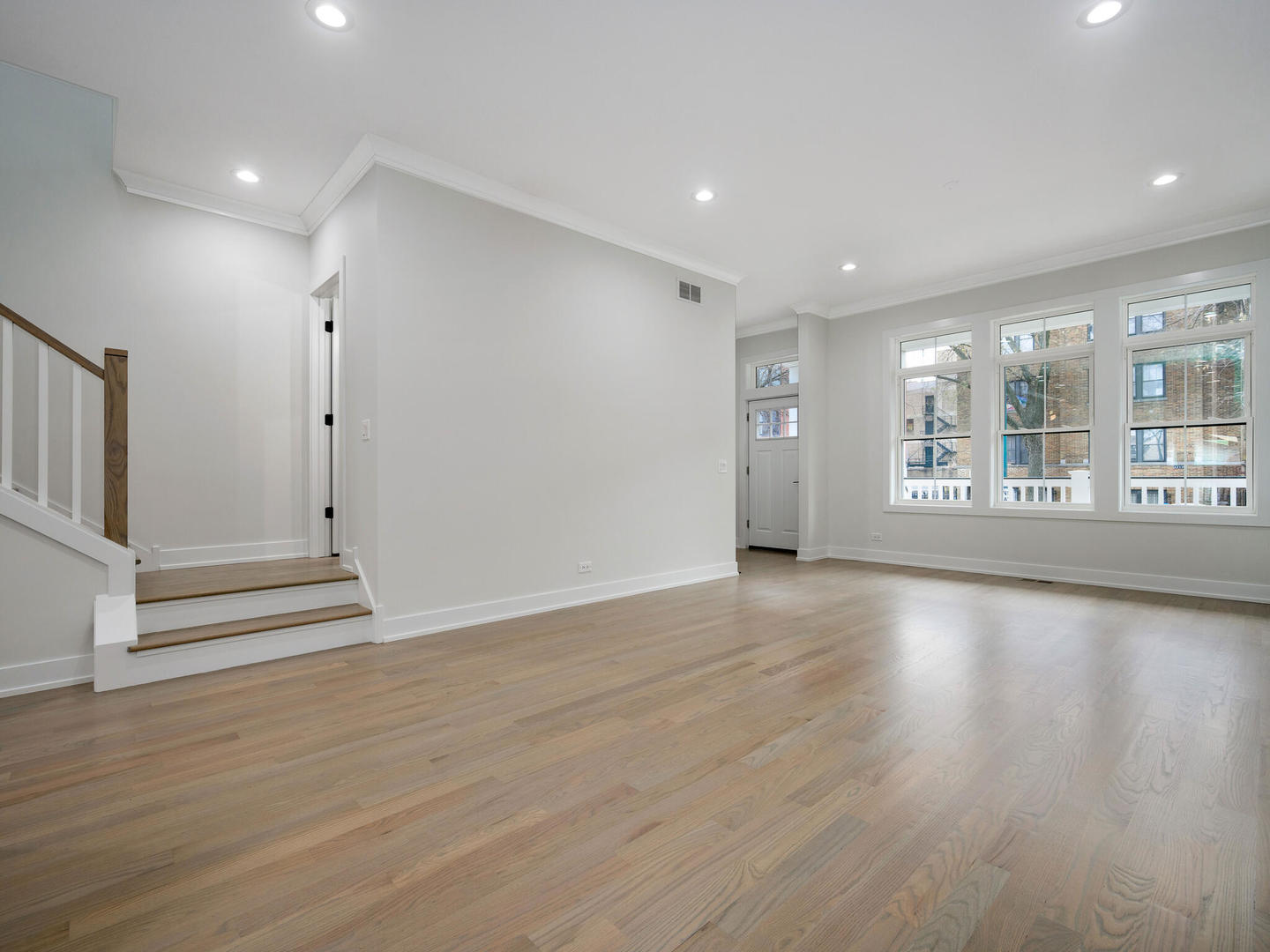 Undisclosed Address Chicago, IL 60618 - Photo 2 of 28 an empty room with wooden floor and windows