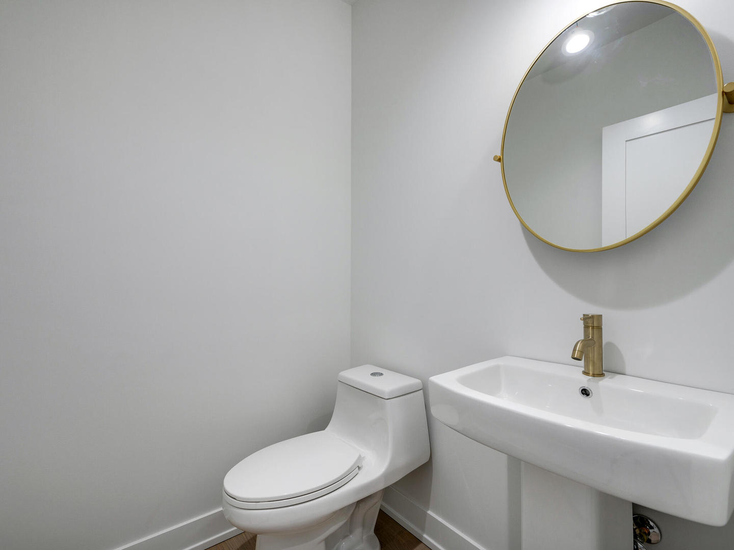 Undisclosed Address Chicago, IL 60618 - Photo 13 of 28 a bathroom with a toilet a sink and mirror