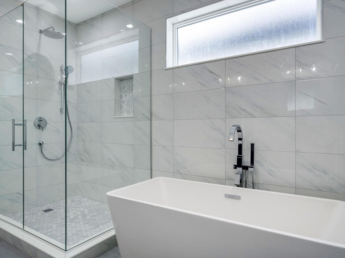 Undisclosed Address Chicago, IL 60618 - Photo 17 of 28 a bathroom with a white bath tub a shower and a sink