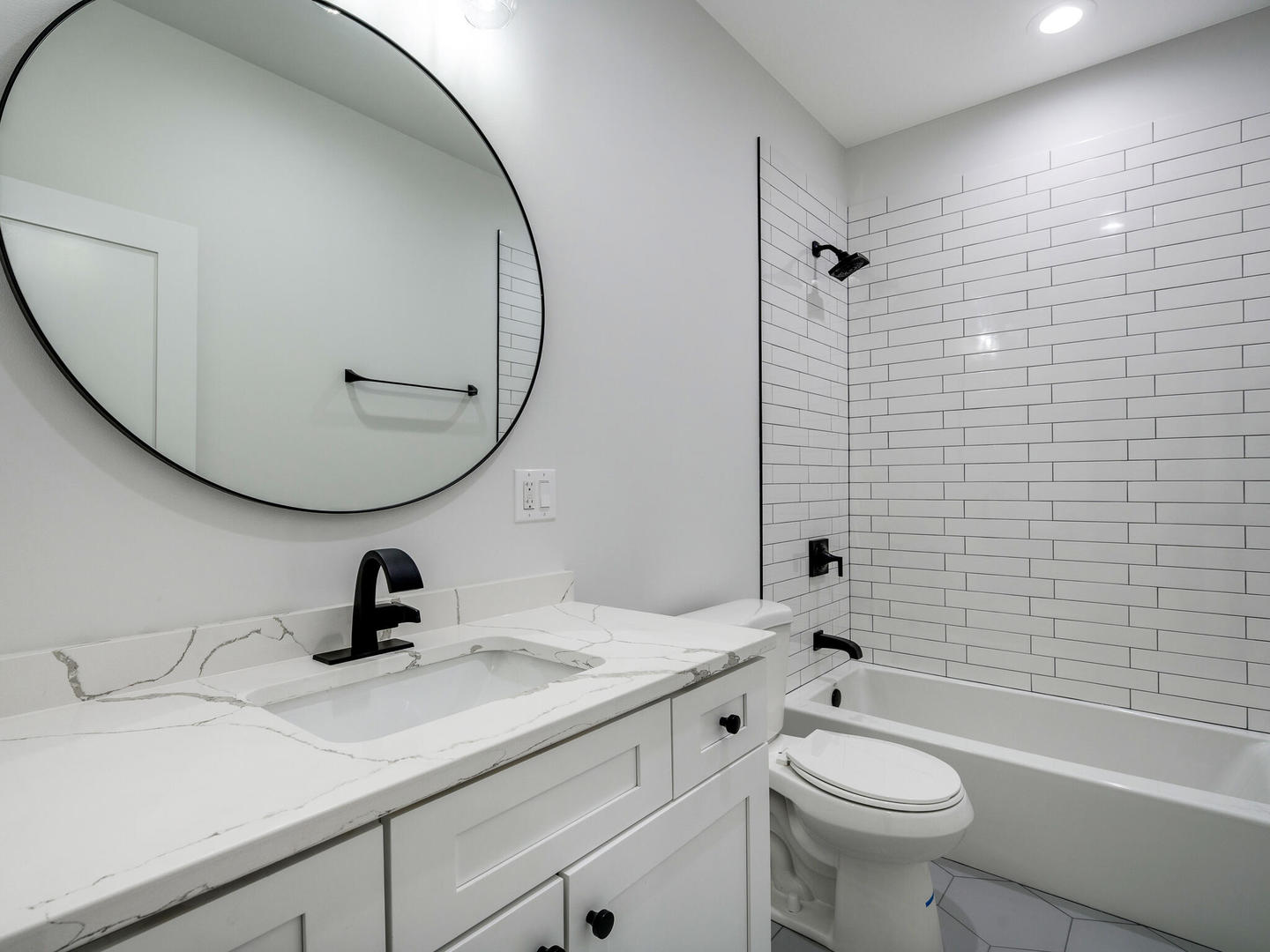 Undisclosed Address Chicago, IL 60618 - Photo 24 of 28 a bathroom with a sink a toilet and a mirror