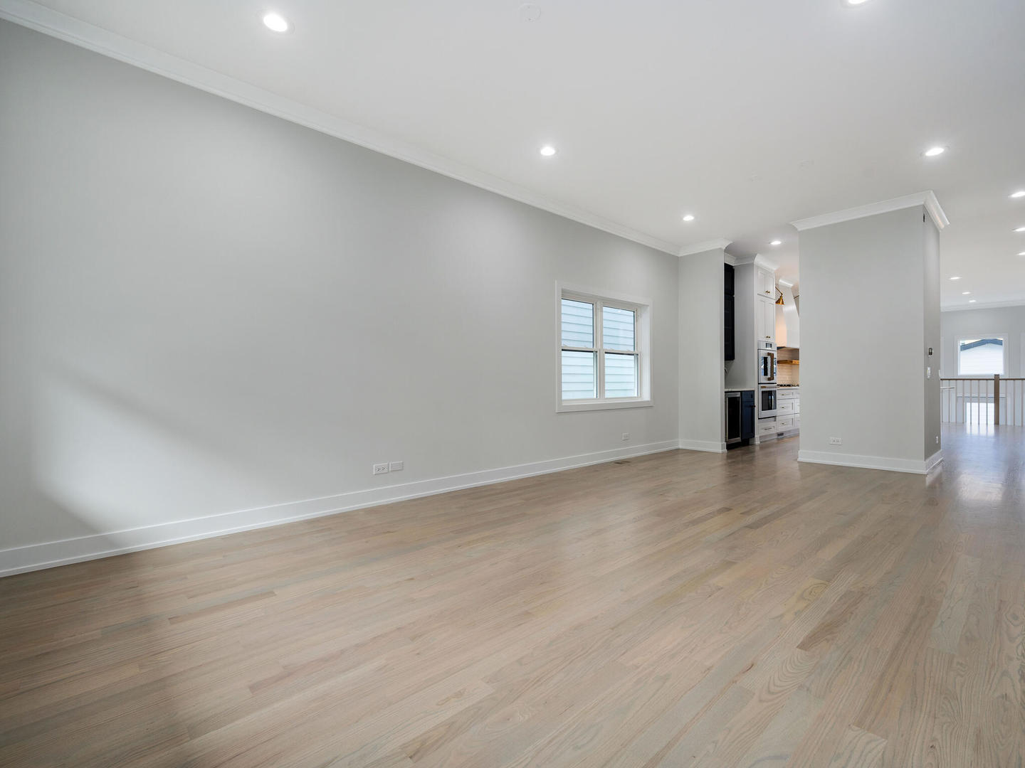 Undisclosed Address Chicago, IL 60618 - Photo 4 of 28 an empty room with wooden floor and windows