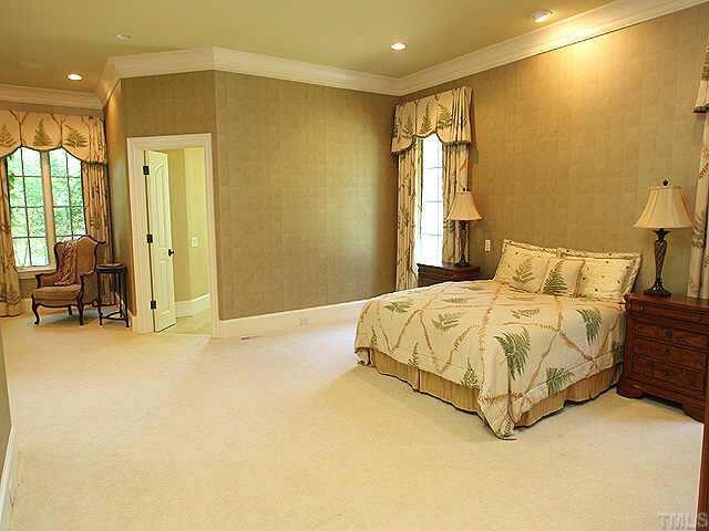 1059 Grayson Road Creedmoor, NC 27522 - Photo 5 of 12 First Floor Master Suite with Sitting Area, Fireplace, Large Walk In Closet, & Access to Covered Porch Area & Backyard.