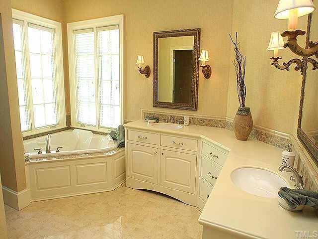 1059 Grayson Road Creedmoor, NC 27522 - Photo 6 of 12 Master Bath Features Jacuzzi Tub, Marble Floor, Double Vanities & Heavy Trim.